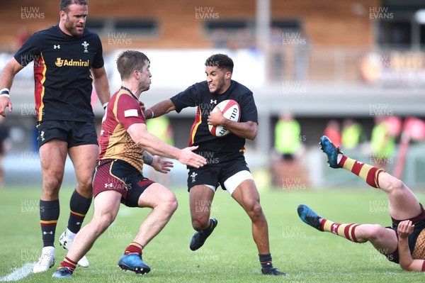 020617 - RGC 1404 v Wales XV - Keelan Giles of Wales is tackled by Tiaan Loots of RGC