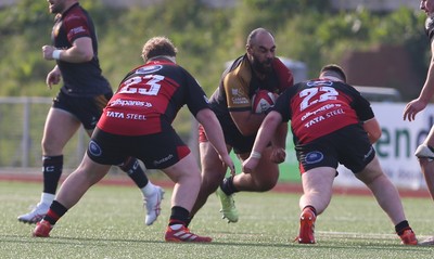 210326 - RGC v Aberavon - Super Rygbi Cymru (SRC) - Jesse Williams of RGC is tackled by Evren Ozbilen and James Clegg of Aberavon