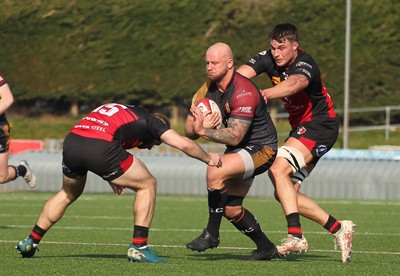 210326 - RGC v Aberavon - Super Rygbi Cymru (SRC) - Delwyn Jones of RGC is tackled by Scott Delnevo of Aberavon
