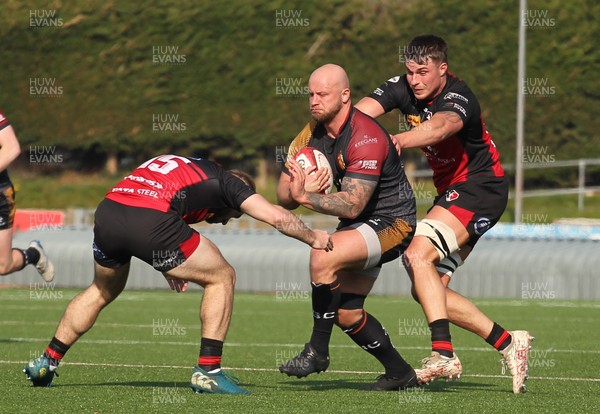 210326 - RGC v Aberavon - Super Rygbi Cymru (SRC) - Delwyn Jones of RGC is tackled by Scott Delnevo of Aberavon