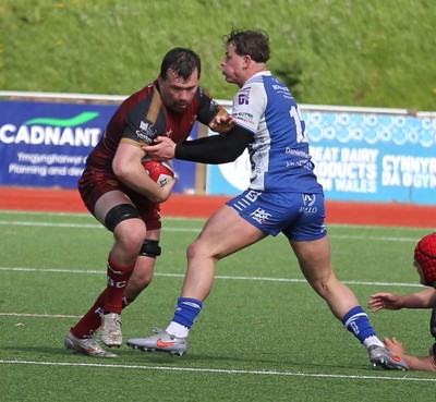 110426 - RGC v Bridgend - Super Rygbi Cymru (SRC) - Sam Williams of RGC is tackled by Fraser Jones of Bridgend