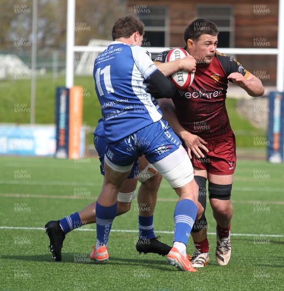 110426 - RGC v Bridgend - Super Rygbi Cymru (SRC) - Harper Chamberllain RGC is tackled by Gabe Lacey of Bridgend