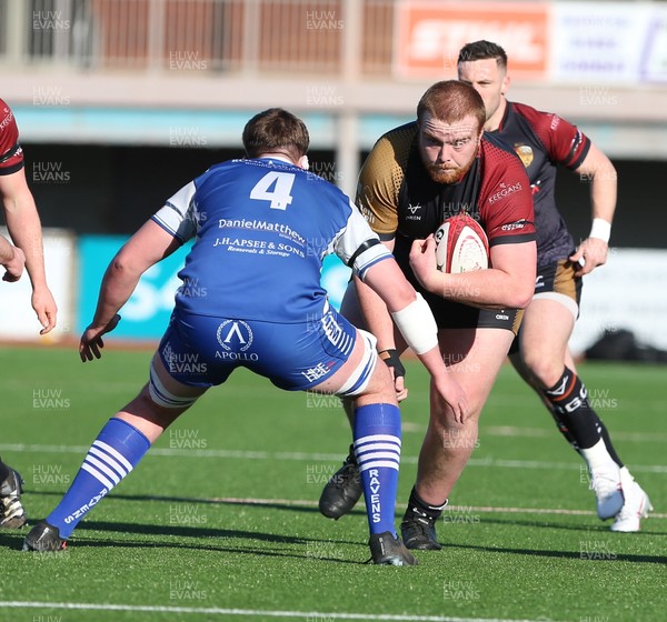 280226 - RGC v Bridgend - Super Rygbi Cymru (SRC) Plate Semi Final - Pedr Jones of RGC runs into Evan Hill  of Bridgend 