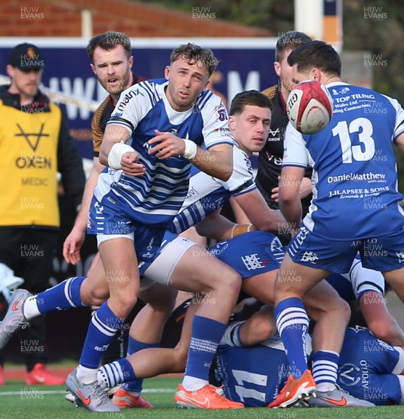 280226 - RGC v Bridgend - Super Rygbi Cymru (SRC) Plate Semi Final - Harvey Nash of Bridgend passes the ball from the ruck