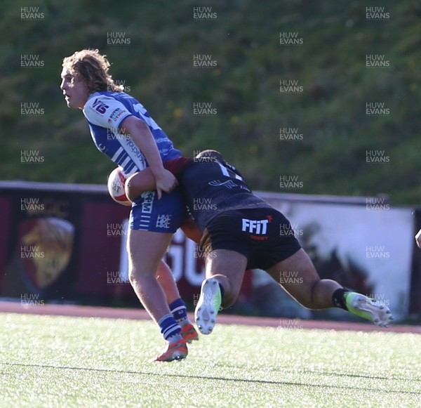 280226 - RGC v Bridgend - Super Rygbi Cymru (SRC) Plate Semi Final - Ben Burnell of Bridgend is tackled by Jesse Williams of of RGC