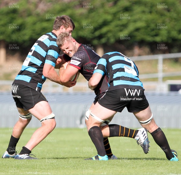 140919 - RGC V Cardiff - Specsavers Cup - Robin Williams of RGC is tackled by James Ratti and Callum Bradley of Cardiff