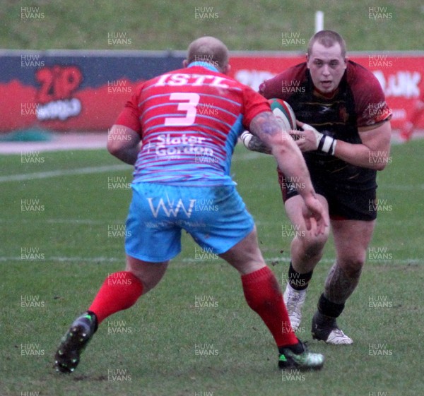 260119 - RGC v Cardiff - WRU National Cup -  Sam Wainwright of RGC is tackled by Kieron Brown of Cardiff 