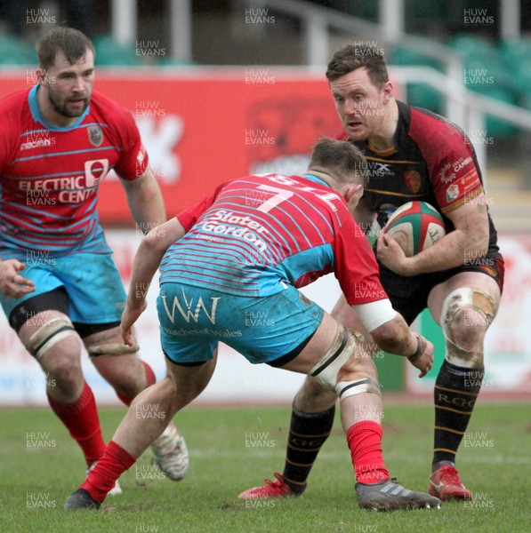 260119 - RGC v Cardiff - WRU National Cup -  Iolo Evans of RGC is tackled by Zach O'Driscoll of Cardiff