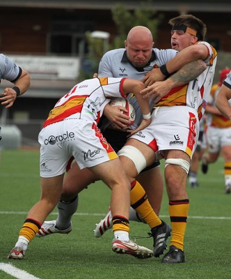 190926 - RGC v Carmarthen Quins - Super Rygbi Cymru (SRC) - Delwyn Jones of RGC is tackled by Madoc Evans of Carmarthen Quins