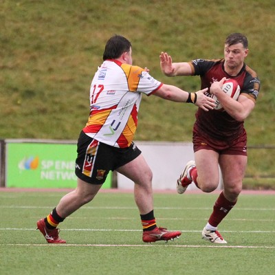 210226 - RGC v  Carmarthen Quins - Super Rygbi Cymru  Cup (SRC) - Dion Jones of RGC fends off Keanu Evans of Carmarthen Quins