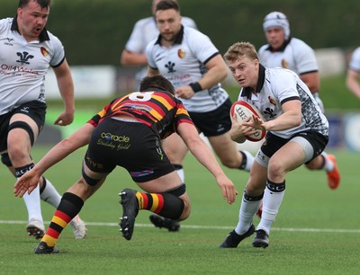 260425 - RGC v Carmarthen Quins - Super Rygbi Cymru (SRC) Playoffs - Dan Roderick of RGC is tackled by Iestyn Wood of Carmarthen Quins
