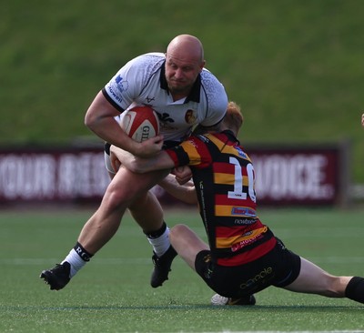 260425 - RGC v Carmarthen Quins - Super Rygbi Cymru (SRC) Playoffs - Welwyn Jones of RGC is tackled by Ifan Davies of Carmarthen Quins