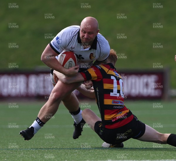260425 - RGC v Carmarthen Quins - Super Rygbi Cymru (SRC) Playoffs - Welwyn Jones of RGC is tackled by Ifan Davies of Carmarthen Quins