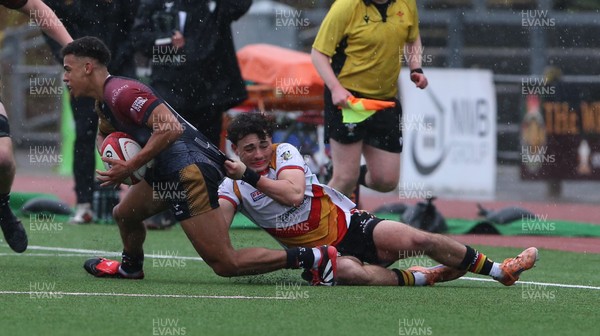 280326 - RGC v Carmarthen Quins - Super Rygbi Cymru (SRC) - Caio Parry of RGC is tackled by Bowen Clark of Carmarthen Quins