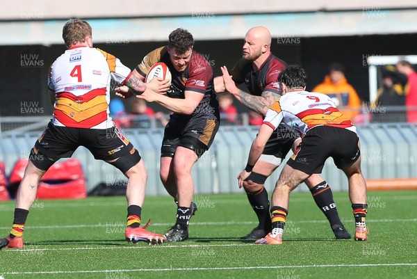280326 - RGC v Carmarthen Quins - Super Rygbi Cymru (SRC) - Dafydd Thirsk of RGC is tackled by Ryan Bean of Carmarthen Quins