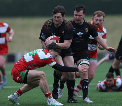 150225 - RGC v  Llandovery - Super Rygbi Cymru (SRC) - Cup Competition - Patrick Nelson of RGC is tackled by Tomi Lewis of Llandovery