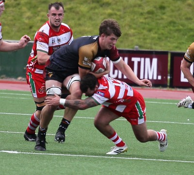 270925 - RGC v Llandovery - Super Rygbi Cymru (SRC) - Will Kellett  of RGC is tackled by Rhodri Jones of Llandovery 
