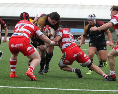 270925 - RGC v Llandovery - Super Rygbi Cymru (SRC) - Patrick Nelson of RGC is tackled by Tom Philips and Dan Gemine of Llandovery