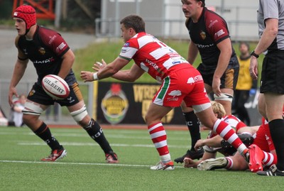 270925 - RGC v Llandovery - Super Rygbi Cymru (SRC) - Aaron Warren of Llandovery passes the ball from the ruck