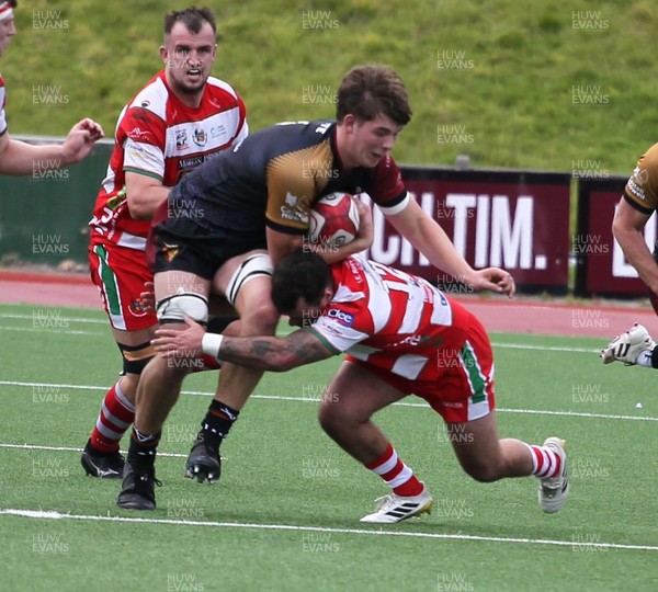 270925 - RGC v Llandovery - Super Rygbi Cymru (SRC) - Will Kellett  of RGC is tackled by Rhodri Jones of Llandovery 