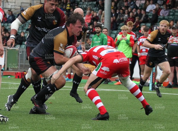 270925 - RGC v Llandovery - Super Rygbi Cymru (SRC) - Sam Williams of RGC is tackled by Llien Morgan of Llandovery 