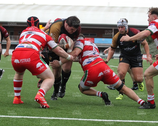 270925 - RGC v Llandovery - Super Rygbi Cymru (SRC) - Patrick Nelson of RGC is tackled by Tom Philips and Dan Gemine of Llandovery