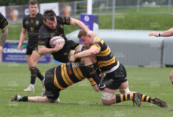 110223 - RGC v Newport - Indigo Group Premiership - Sam Williams of RGC is tackled by George Young and Craig Hudd of Newport RFC