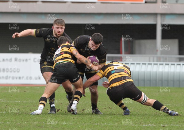110223 - RGC v Newport - Indigo Group Premiership - Ilan Evans of RGC is tackled by Kyle Taylor and Chay Foster Smith of Newport RFC