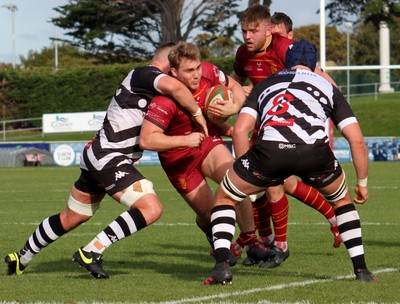 121019 - RGC v Pontypridd - Indigo Group Premiership -   Rhys Williams of RGC is tackled by Kristian Parker of Pontypridd