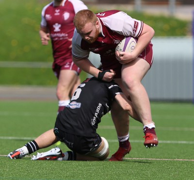 130424 - RGC v Pontypridd - Indigo Group Premiership - Pedr Jones of RGC is tackled by Cai James of Pontypridd RFC