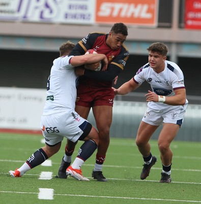181025 - RGC v Swansea - Super Rygbi Cymru (SRC) - Mathew Aubrey of Swansea passes the ball from the ruck Gethin O’Callaghan is tackled by Jacob Hopkins of Swansea