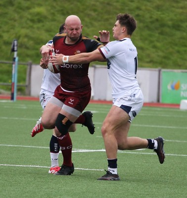181025 - RGC v Swansea - Super Rygbi Cymru (SRC) - Delwyn Jones of RGC fends off Josh Philips of Swansea