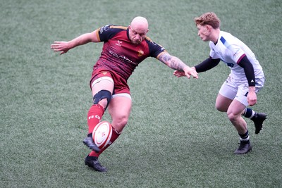 070326 - RGC v Swansea RFC - SRC plate Final - Danny Cross of RGC attempts to kick the ball away but follows through with a tackle from Harri Houston of Swansea
