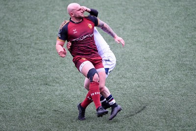070326 - RGC v Swansea RFC - SRC plate Final - Danny Cross of RGC attempts to kick the ball away but follows through with a tackle from Harri Houston of Swansea