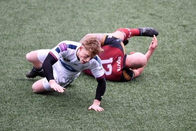 070326 - RGC v Swansea RFC - SRC plate Final - Danny Cross of RGC attempts to kick the ball away but follows through with a tackle from Harri Houston of Swansea