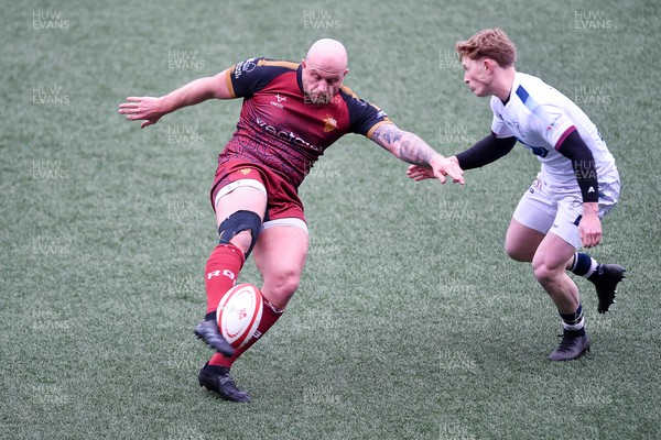 070326 - RGC v Swansea RFC - SRC plate Final - Danny Cross of RGC attempts to kick the ball away but follows through with a tackle from Harri Houston of Swansea