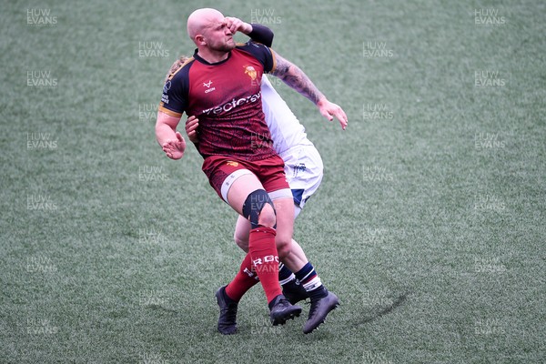 070326 - RGC v Swansea RFC - SRC plate Final - Danny Cross of RGC attempts to kick the ball away but follows through with a tackle from Harri Houston of Swansea