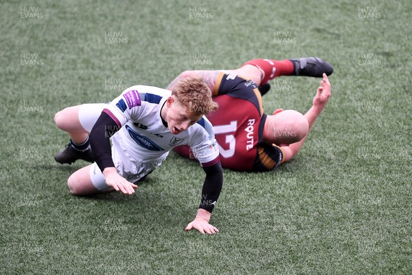 070326 - RGC v Swansea RFC - SRC plate Final - Danny Cross of RGC attempts to kick the ball away but follows through with a tackle from Harri Houston of Swansea