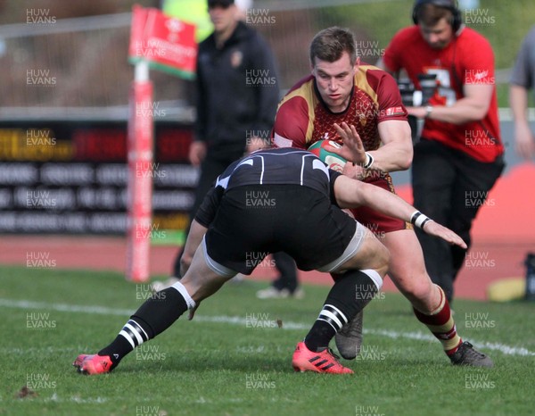 140418 - RGC1404 v Bedwas - Principality Premiership -   Tom Hughes is tackled by Steffan Jones of Bedwas 