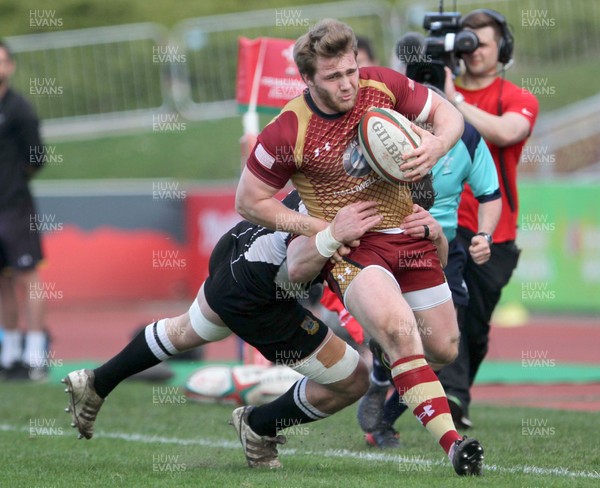 140418 - RGC1404 v Bedwas - Principality Premiership -   Rhys Wiliams of RGC is tackled by Andrew Waite of Bedwas