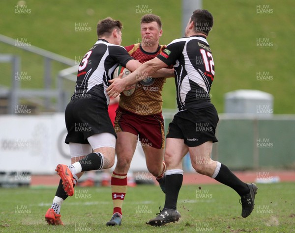 140418 - RGC1404 v Bedwas - Principality Premiership -   Dion Jones of RGC is tackled by Rhys Hutcherson and Adam Williams of Bedwas
