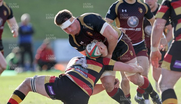 170218 - RGC1404 v Carmarthen Quins - Principality Premiership -  Andy Williams of RGC1404 is tackled by Josh Phelps of Carmarthen Quins RFC