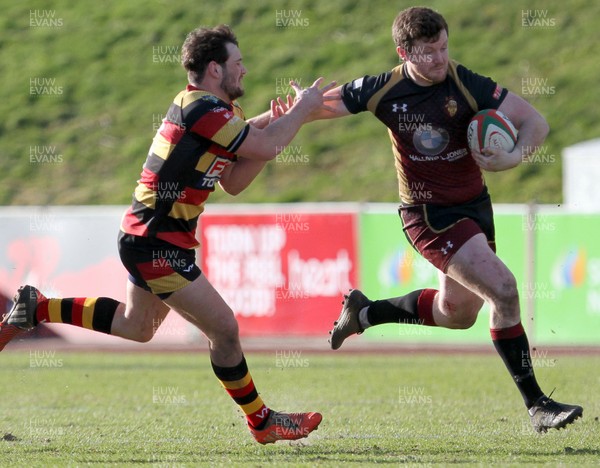 170218 - RGC1404 v Carmarthen Quins - Principality Premiership -  Iolo Evans of RGC1404 is tackled by Joshua Batchup of Carmarthen Quins RFC