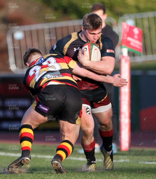 170218 - RGC1404 v Carmarthen Quins - Principality Premiership -  Rhys Williams of RGC1404 is tackled by Morgan Griffiths of Carmarthen Quins RFC
