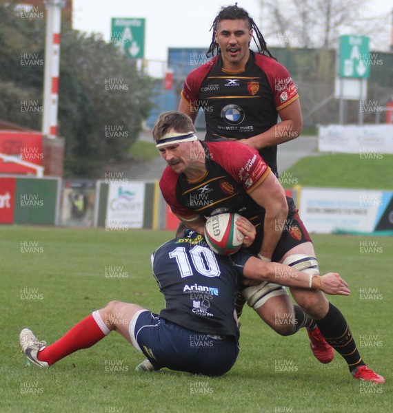241118 - RGC1404 v Llanelli - Principality Premiership -  Andy Williams of RGC is tackled by Ioan Hughes of Llanelli