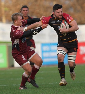 221218 - RGC1404 v Swansea - Principality Premiership -  Mei Parry of RGC fends off Callum Bowden of Swansea