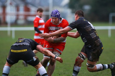 060124 - Rhiwbina v Ynysybwl - Admiral National League 1 East Central - Jack Griffiths of Ynysybwl is tackled by Jeffery Young (L) and James Seaton of Rhiwbina