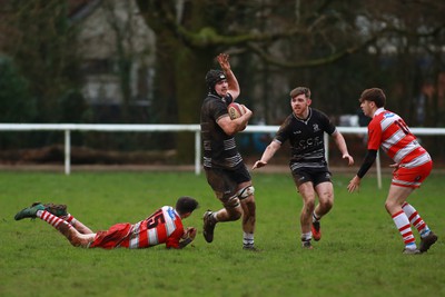 060124 - Rhiwbina v Ynysybwl - Admiral National League 1 East Central - George Southcombe of Rhiwbina skips through the tackle of Mason Pritchard of Ynysybwl