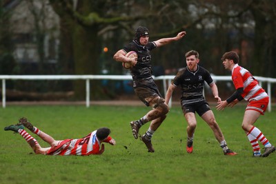 060124 - Rhiwbina v Ynysybwl - Admiral National League 1 East Central - George Southcombe of Rhiwbina skips through the tackle of Mason Pritchard of Ynysybwl