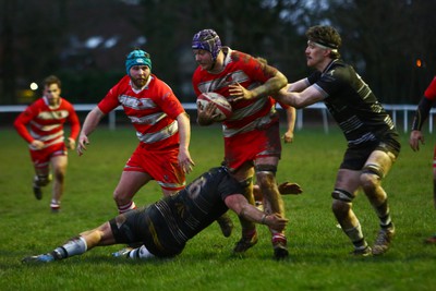 060124 - Rhiwbina v Ynysybwl - Admiral National League 1 East Central - Jack Griffiths of Ynysybwl is tackled by Jeffery Young of Rhiwbina 